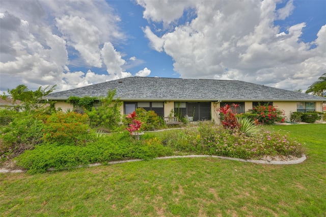 1915 W Del Webb Blvd, Sun City Center, FL 33573 - ranch-style house featuring a front lawn and stucco siding