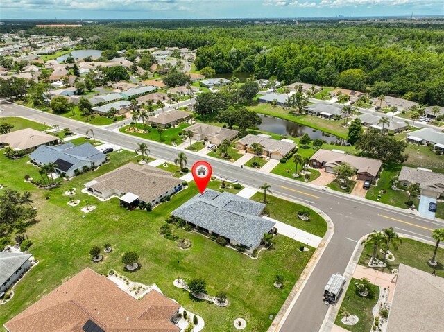 1915 W Del Webb Blvd, Sun City Center, FL 33573 - aerial view of property and surrounding area featuring a nearby body of water, a forest, and nearby suburban area