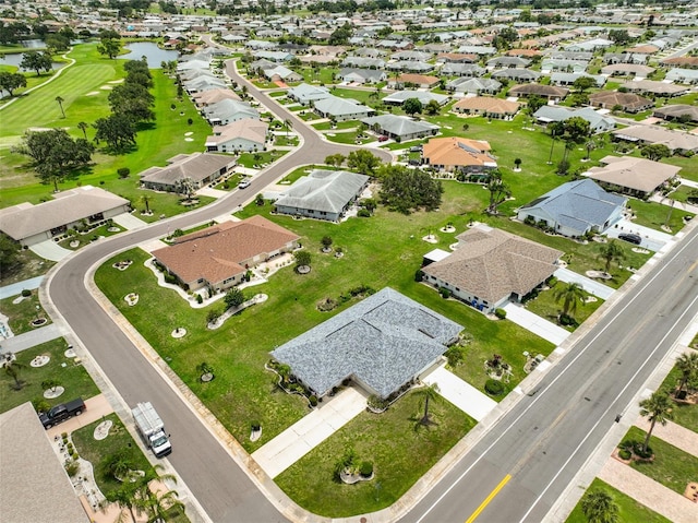 1915 W Del Webb Blvd, Sun City Center, FL 33573 - aerial view of property and surrounding area featuring nearby suburban area, a nearby body of water, and a golf course