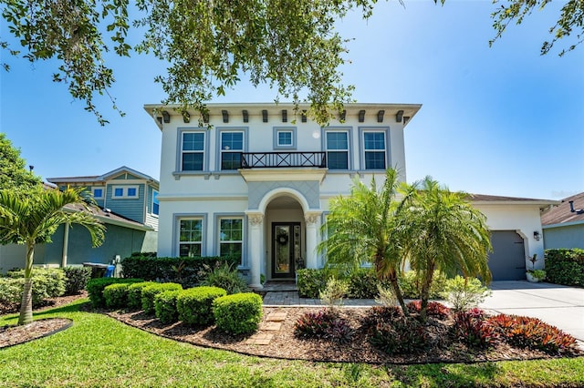 15422 Starling Crossing Dr, Lithia, FL 33547 - view of front of property with concrete driveway, stucco siding, a garage, and a balcony