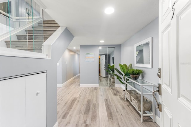 1390 Gulf Blvd Unit Ph-5, Clearwater, FL 33767 - entrance foyer with wood finished floors, baseboards, recessed lighting, and stairs