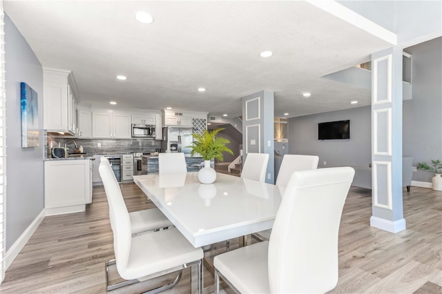 1390 Gulf Blvd Unit Ph-5, Clearwater, FL 33767 - dining room featuring recessed lighting, light wood-style flooring, wine cooler, and baseboards