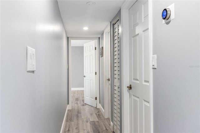 1390 Gulf Blvd Unit Ph-5, Clearwater, FL 33767 - hall with light wood finished floors, baseboards, and recessed lighting