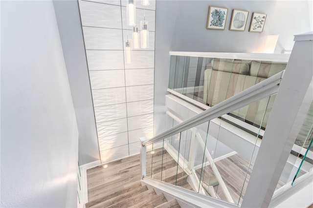 1390 Gulf Blvd Unit Ph-5, Clearwater, FL 33767 - stairway featuring wood finished floors