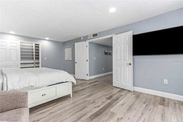 1390 Gulf Blvd Unit Ph-5, Clearwater, FL 33767 - bedroom featuring light wood finished floors, recessed lighting, and baseboards