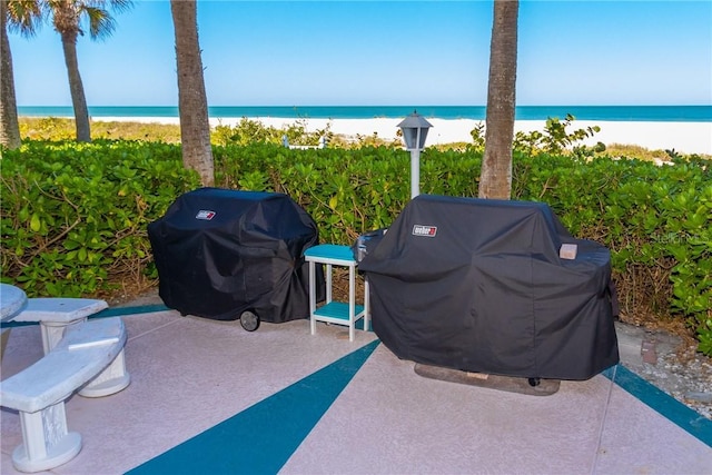 1390 Gulf Blvd Unit Ph-5, Clearwater, FL 33767 - view of patio with view of water and beach and grilling area