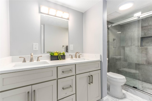 1390 Gulf Blvd Unit Ph-5, Clearwater, FL 33767 - bathroom with marble look tile flooring, toilet, double vanity, and a stall shower