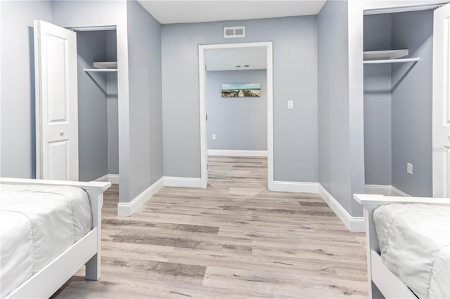 1390 Gulf Blvd Unit Ph-5, Clearwater, FL 33767 - bedroom with light wood finished floors and baseboards