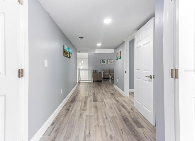 1390 Gulf Blvd Unit Ph-5, Clearwater, FL 33767 - hall featuring light wood finished floors, baseboards, and recessed lighting