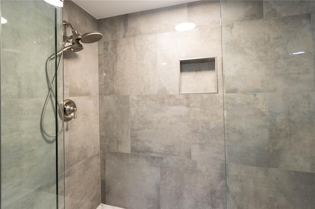 1390 Gulf Blvd Unit Ph-5, Clearwater, FL 33767 - bathroom featuring a tile shower
