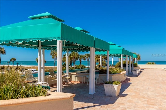 1390 Gulf Blvd Unit Ph-5, Clearwater, FL 33767 - view of patio / terrace with a gazebo and view of water and beach