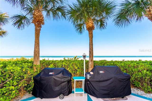 1390 Gulf Blvd Unit Ph-5, Clearwater, FL 33767 - view of patio / terrace featuring view of water and beach and grilling area