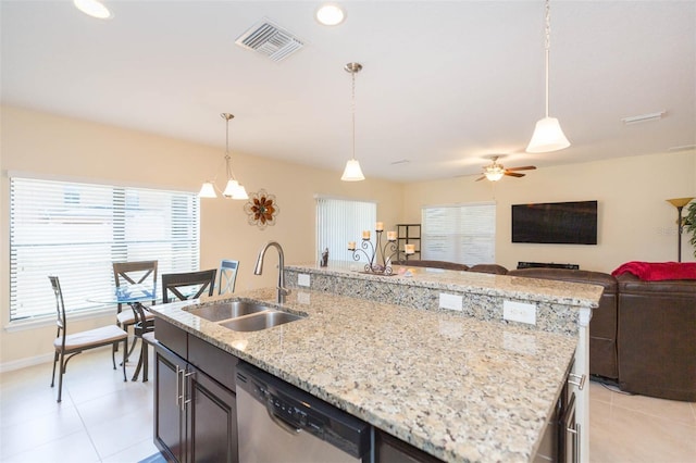 kitchen with stainless steel dishwasher, visible vents, open floor plan, ceiling fan, and a sink