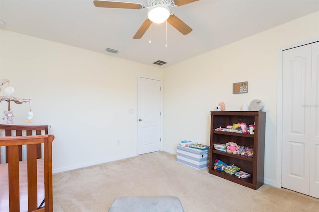 bedroom with baseboards, visible vents, ceiling fan, and carpet