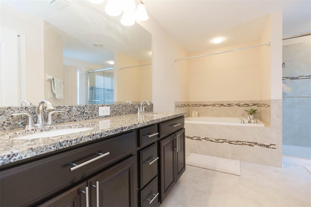 full bath featuring a sink, tile patterned flooring, a shower stall, and visible vents