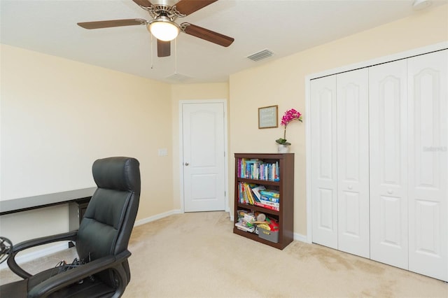 office area featuring carpet flooring, ceiling fan, visible vents, and baseboards