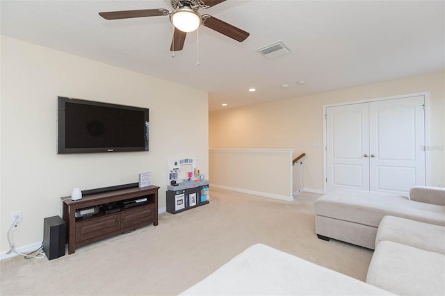 living area featuring a ceiling fan, visible vents, carpet floors, baseboards, and recessed lighting