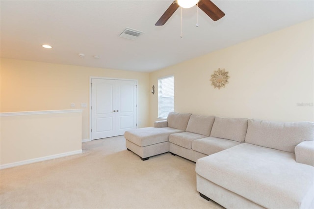 living area with visible vents, baseboards, ceiling fan, recessed lighting, and light colored carpet