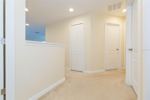 hall featuring carpet flooring, recessed lighting, baseboards, and visible vents