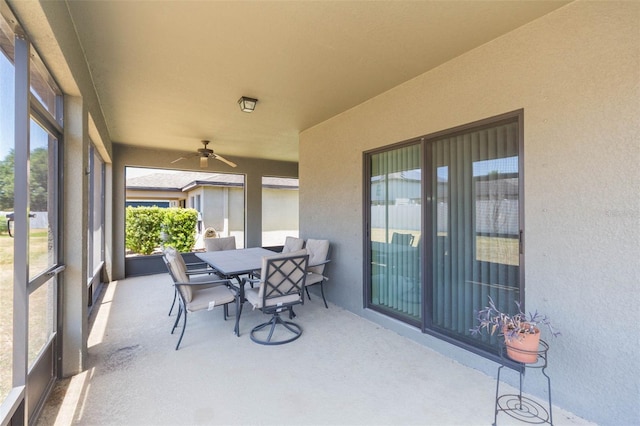 view of patio / terrace with a ceiling fan and outdoor dining area