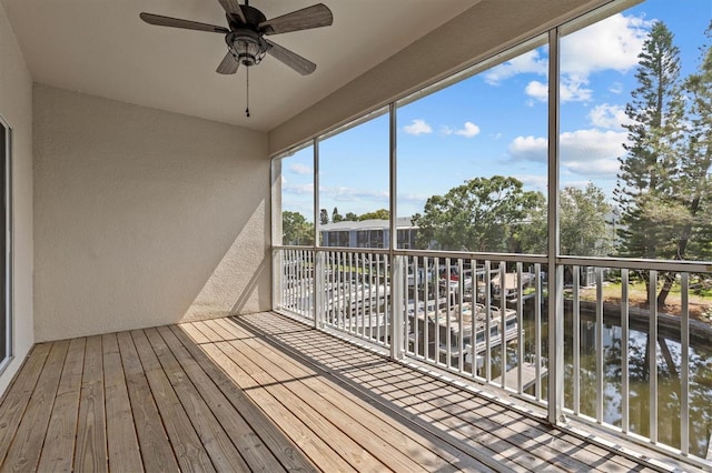 unfurnished sunroom featuring a water view