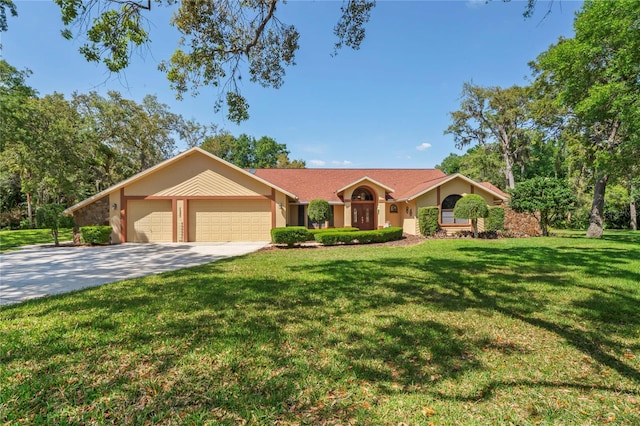 7353 Dogwood Cres, Spring Hill, FL 34607 - ranch-style home with a garage, a front yard, concrete driveway, and stucco siding