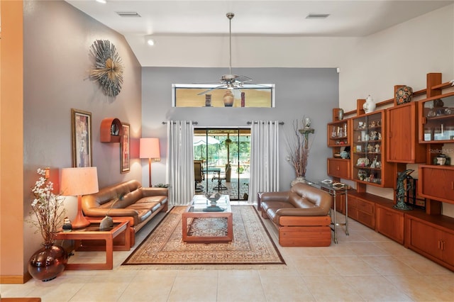 7353 Dogwood Cres, Spring Hill, FL 34607 - living room featuring high vaulted ceiling, a ceiling fan, and light tile patterned floors