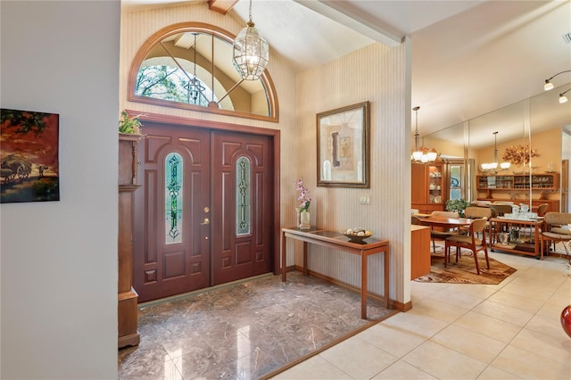 7353 Dogwood Cres, Spring Hill, FL 34607 - foyer with a chandelier, baseboards, and tile patterned floors