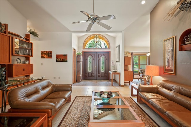 7353 Dogwood Cres, Spring Hill, FL 34607 - foyer entrance featuring a ceiling fan, high vaulted ceiling, light tile patterned floors, and baseboards