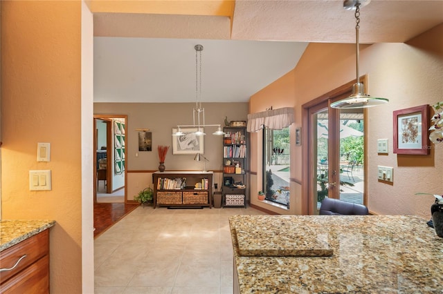 7353 Dogwood Cres, Spring Hill, FL 34607 - bedroom with lofted ceiling, access to exterior, light tile patterned floors, and a textured wall
