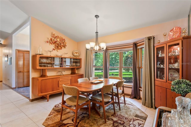 7353 Dogwood Cres, Spring Hill, FL 34607 - dining space with a chandelier, light tile patterned flooring, and lofted ceiling
