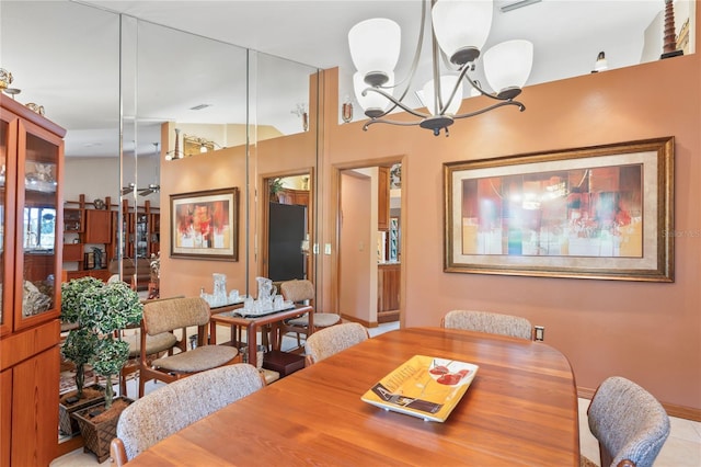 7353 Dogwood Cres, Spring Hill, FL 34607 - dining space with a chandelier and baseboards