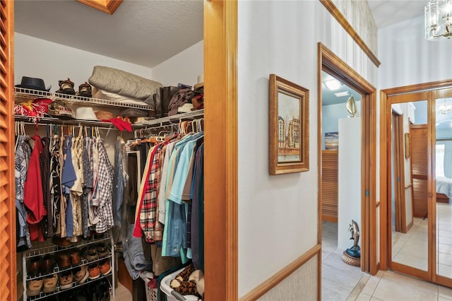 7353 Dogwood Cres, Spring Hill, FL 34607 - spacious closet featuring tile patterned flooring