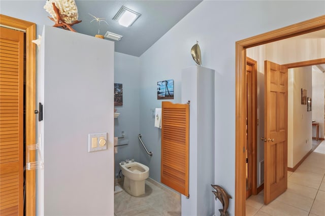 7353 Dogwood Cres, Spring Hill, FL 34607 - bathroom with tile patterned flooring, a bidet, and vaulted ceiling
