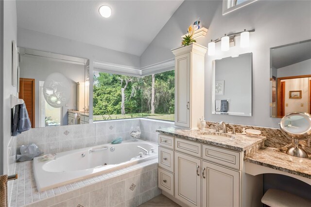 7353 Dogwood Cres, Spring Hill, FL 34607 - full bath with lofted ceiling, a tub with jets, and vanity