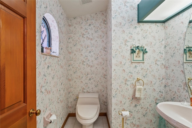 7353 Dogwood Cres, Spring Hill, FL 34607 - bathroom featuring tile patterned floors, toilet, and baseboards