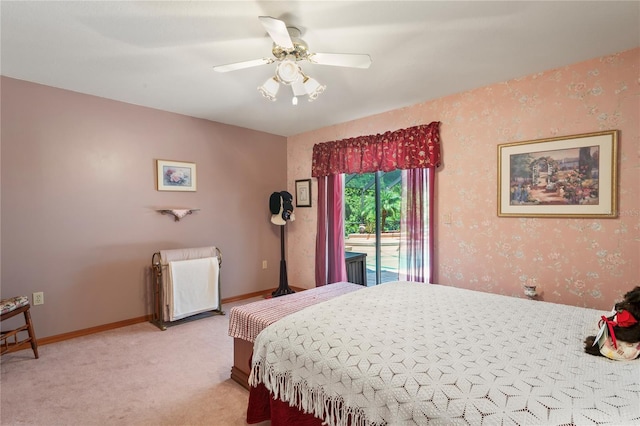 7353 Dogwood Cres, Spring Hill, FL 34607 - bedroom featuring light carpet, access to outside, wallpapered walls, and ceiling fan