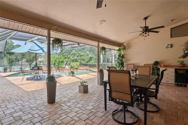 7353 Dogwood Cres, Spring Hill, FL 34607 - view of patio / terrace with ceiling fan, glass enclosure, an outdoor pool, and outdoor dining space