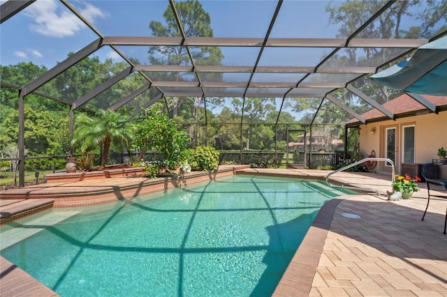 7353 Dogwood Cres, Spring Hill, FL 34607 - outdoor pool featuring french doors, a patio area, and glass enclosure