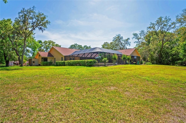 7353 Dogwood Cres, Spring Hill, FL 34607 - view of green lawn featuring glass enclosure