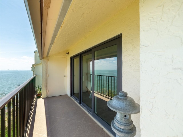 balcony featuring a water view