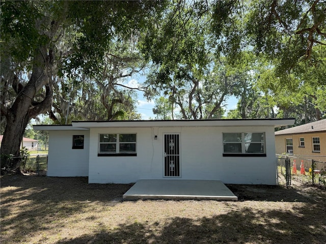 635 Mccormick St, Daytona Beach, FL 32114 - rear view of property with a patio and fence