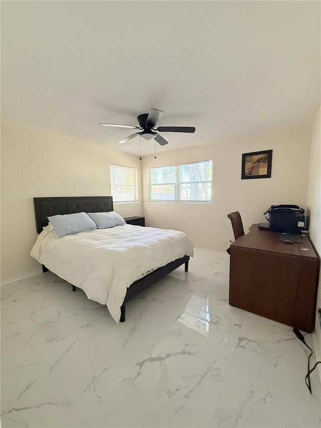 635 Mccormick St, Daytona Beach, FL 32114 - bedroom with baseboards, ceiling fan, and marble finish floor