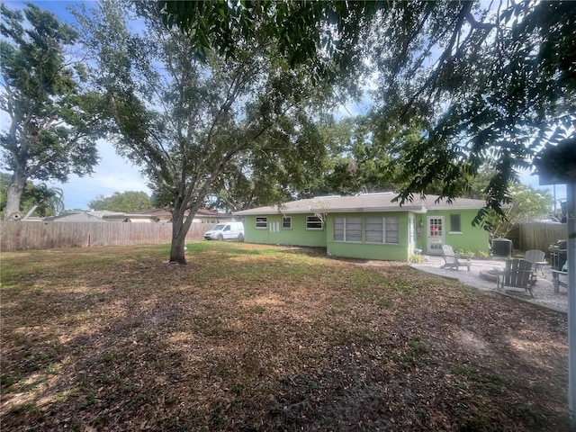 view of yard featuring a patio and fence