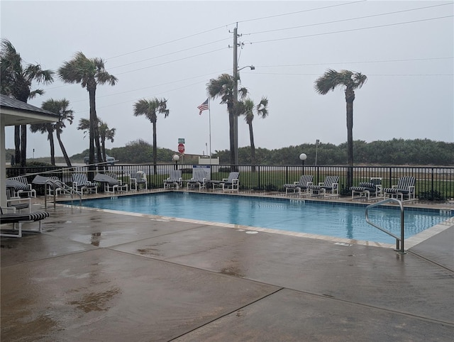 3100 Ocean Shore Blvd Unit 101, Ormond Beach, FL 32176 - community pool featuring fence and a patio area