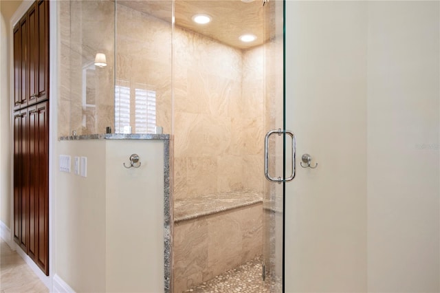 full bath featuring tiled shower