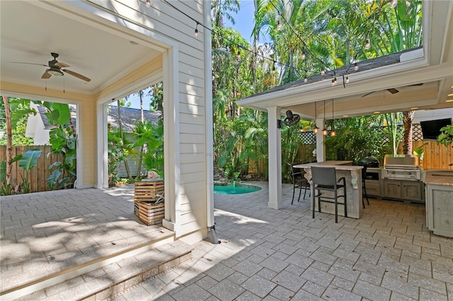 view of patio / terrace featuring ceiling fan, grilling area, and a fenced backyard