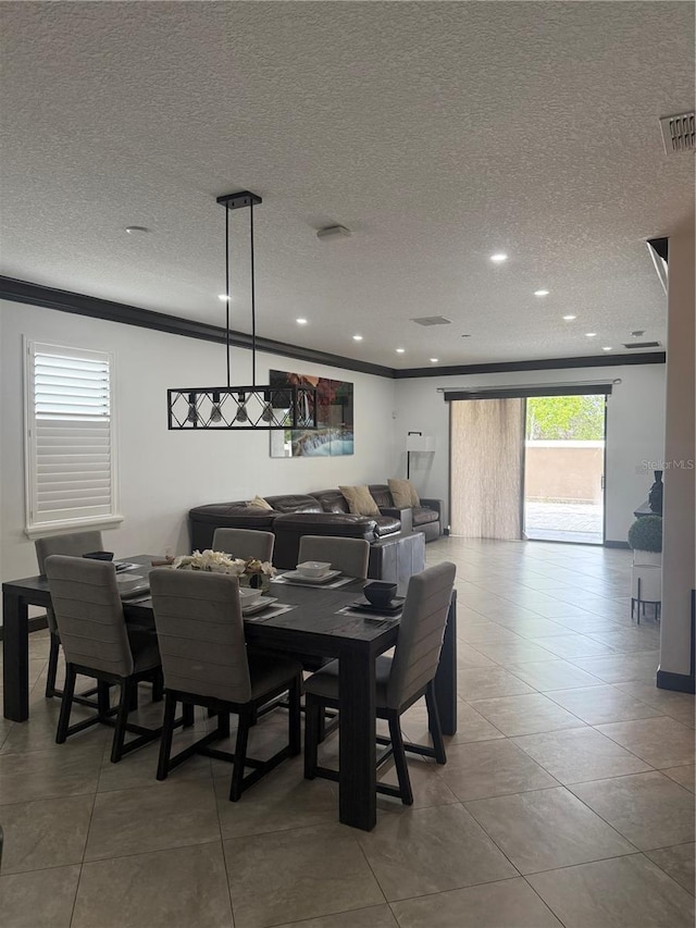dining room with visible vents, recessed lighting, a textured ceiling, and crown molding