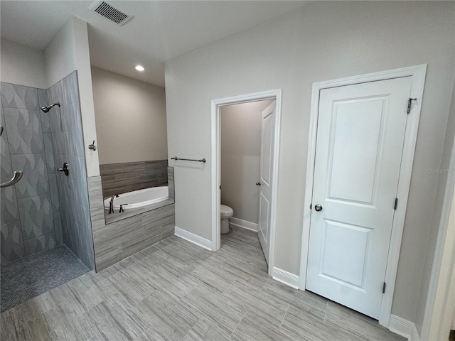 bathroom featuring toilet, visible vents, recessed lighting, a garden tub, and tiled shower