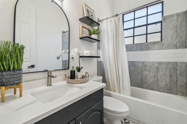 bathroom with toilet, shower / bath combo with shower curtain, and vanity